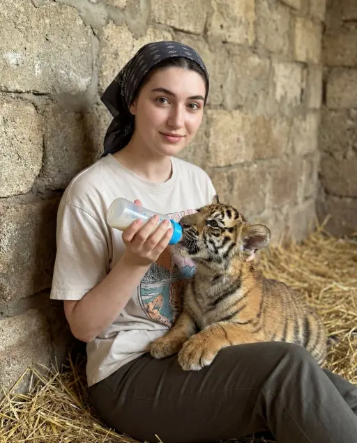 { "scene_type": "lifestyle portrait with animal interaction", "composition": { "...