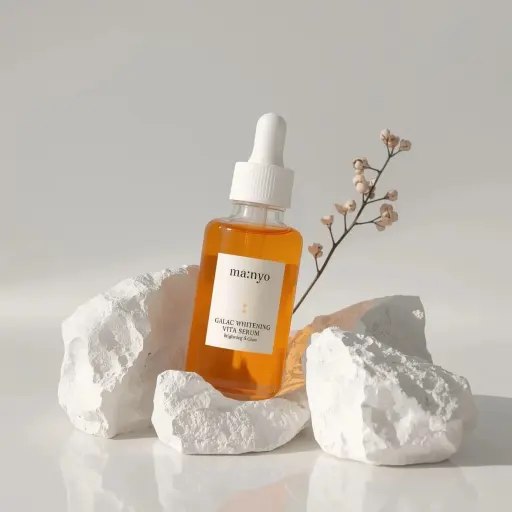 Minimalist studio product photography of an amber glass dropper serum bottle wit...